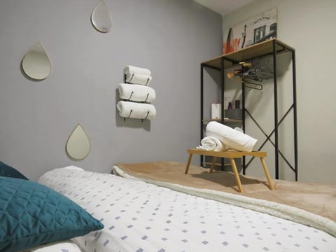 Bed, Photo of the whole room, Bedroom, flat iron, hair dryier, towels