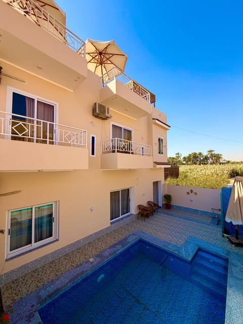 Property building, Patio, Day, View (from property/room), Balcony/Terrace, Pool view, Swimming pool, sunbed