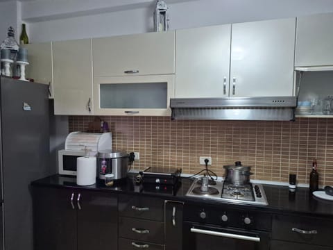 Kitchen or kitchenette, dishwasher, oven, stove, toaster