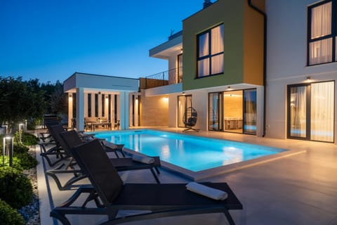 Property building, Patio, Night, Pool view, Swimming pool, sunbed