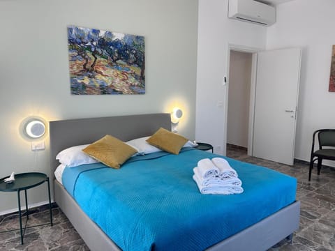 Bed, Photo of the whole room, Bedroom, towels, air conditioner