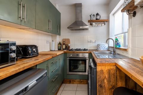 Kitchen or kitchenette, microwave, oven, stove, toaster