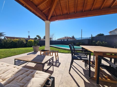 Property building, Patio, Living room, Swimming pool