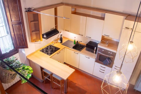 Kitchen or kitchenette, dishwasher, oven, stove