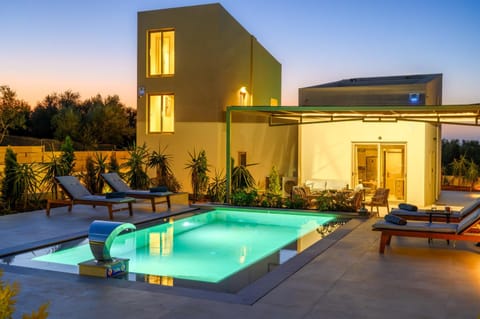 Property building, Patio, Seating area, Pool view, Swimming pool, Sunset, Inner courtyard view, sunbed, towels