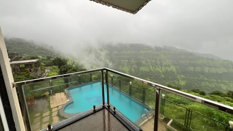 View (from property/room), Balcony/Terrace, Mountain view, Pool view
