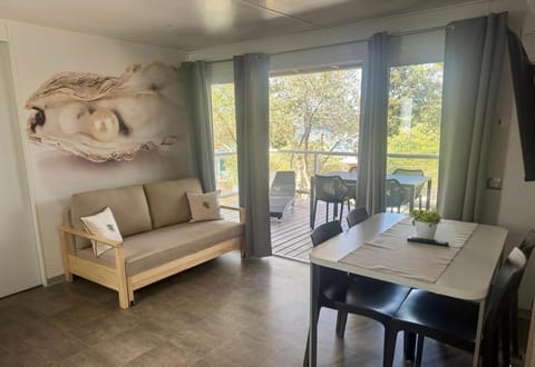 View (from property/room), Balcony/Terrace, Living room, Seating area, Dining area, Garden view, Sea view