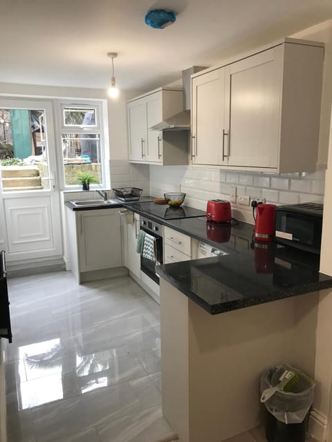 Kitchen or kitchenette, stove, toaster
