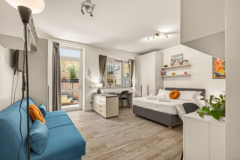 Bed, Living room, Seating area, Bedroom