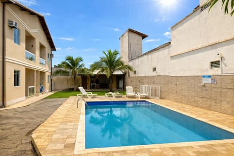 Property building, Day, Pool view, Swimming pool, sunbed