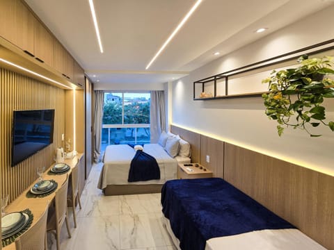 Communal lounge/ TV room, Bed, TV and multimedia, Living room, Photo of the whole room, Seating area, Bedroom