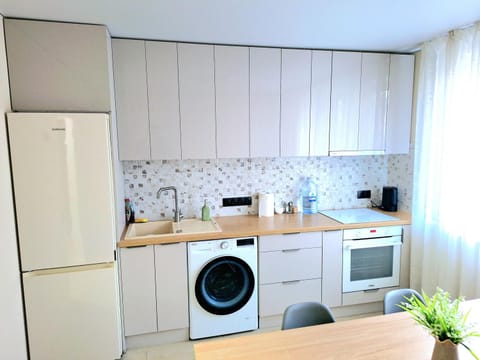 Kitchen or kitchenette, washing machine