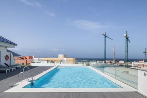 Property building, Living room, Swimming pool