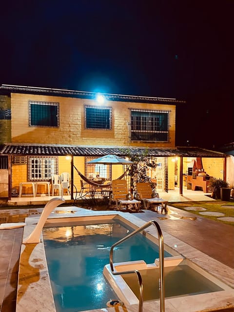 Property building, Patio, Night, Pool view, Swimming pool, sunbed
