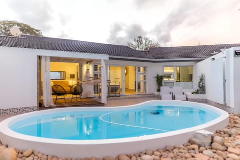 Property building, Patio, Day, Natural landscape, Pool view, Swimming pool, Swimming pool, sunbed