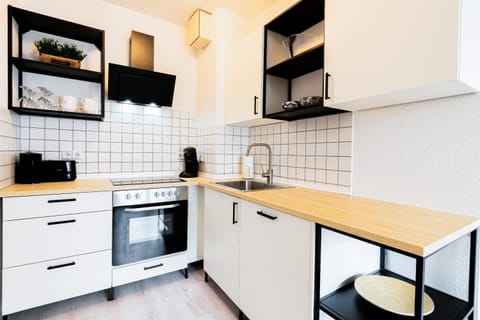 Kitchen or kitchenette, oven, stove