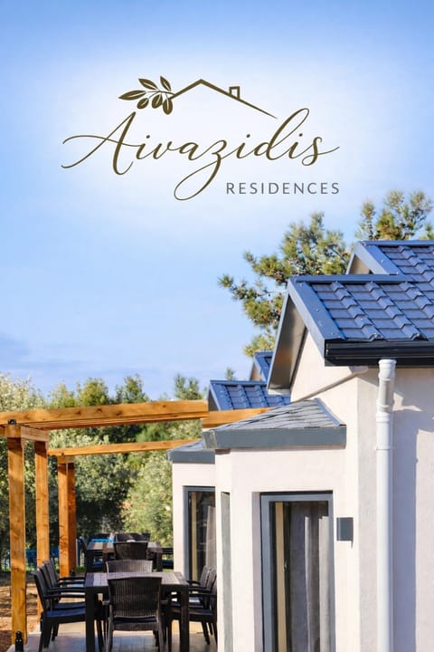 Property building, Patio, Day, Property logo or sign, Natural landscape, View (from property/room), Balcony/Terrace, Dining area, Logo/Certificate/Sign, Text overlay