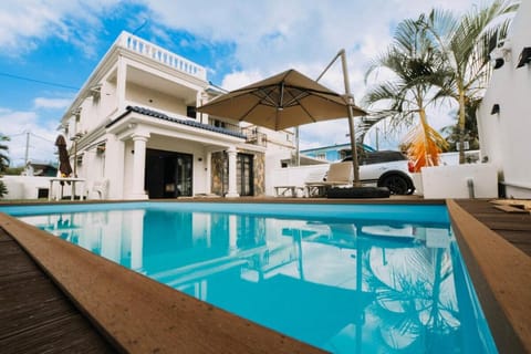 Property building, Patio, Pool view, Swimming pool, sunbed