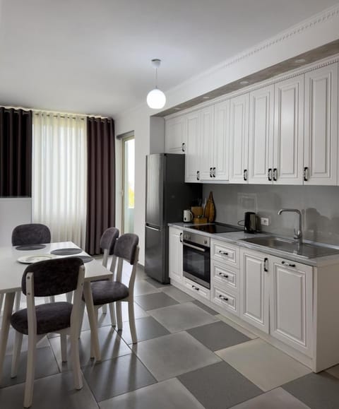 Kitchen or kitchenette, Seating area, Dining area, dishwasher, oven, stove
