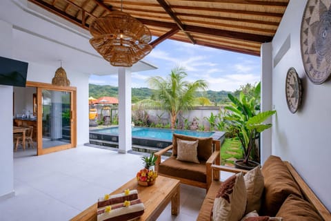 Natural landscape, View (from property/room), Living room, Seating area, Swimming pool