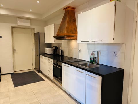 Kitchen or kitchenette, dishwasher, oven, stove