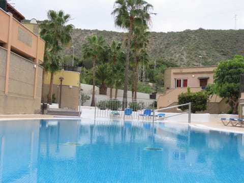 Property building, Nearby landmark, Day, Mountain view, Pool view, Swimming pool, sunbed