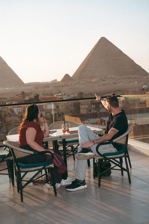 Patio, Restaurant/places to eat, Day, People, Natural landscape, View (from property/room), Balcony/Terrace, Living room, Banquet/Function facilities, Seating area, Dining area, Guests, Landmark view, Landmark view, group of guests