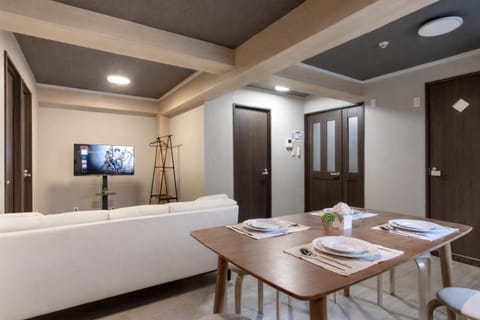 Bed, TV and multimedia, Living room, Seating area, Dining area