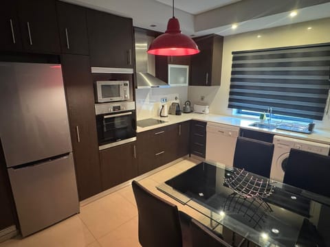 Kitchen or kitchenette, dishwasher, oven, stove, washing machine, kitchen