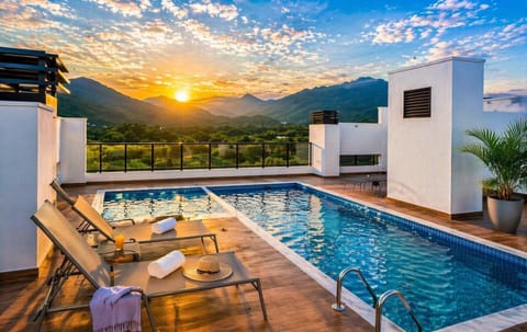 Property building, Patio, Day, Natural landscape, Mountain view, Pool view, Swimming pool, Sunrise, Sunset, sunbed