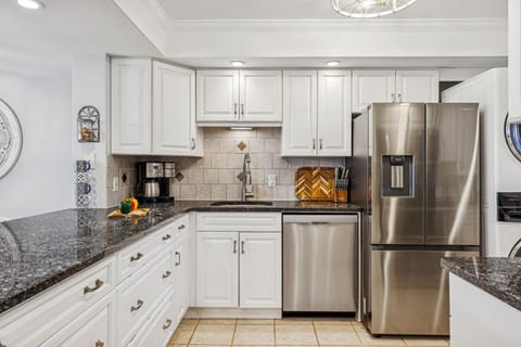 Kitchen or kitchenette, dishwasher, oven, stove, toaster