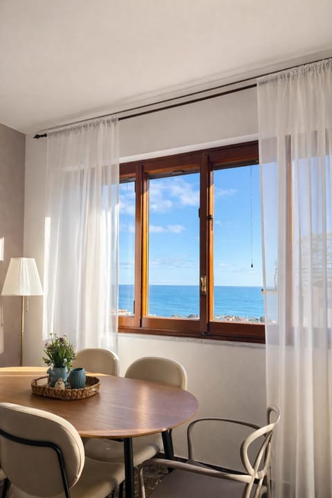 Natural landscape, View (from property/room), Living room, Seating area, Dining area, City view, Sea view, Sunset