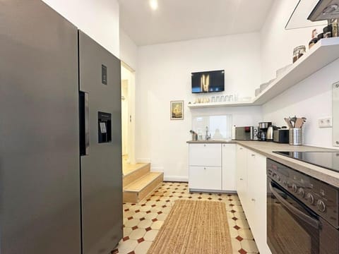 Kitchen or kitchenette, dishwasher, oven, stove, toaster
