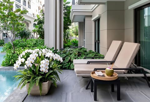Property building, Patio, Spring, Day, Garden, View (from property/room), Balcony/Terrace, Garden view, Pool view, sunbed