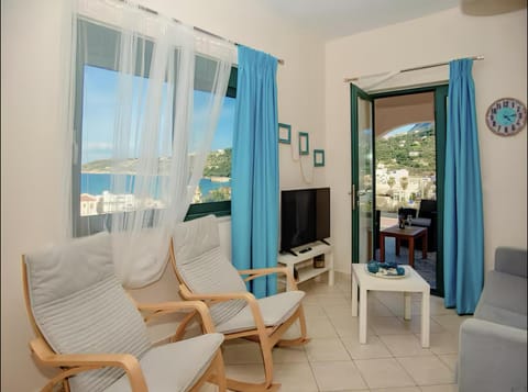 TV and multimedia, View (from property/room), Living room, Seating area, Sea view