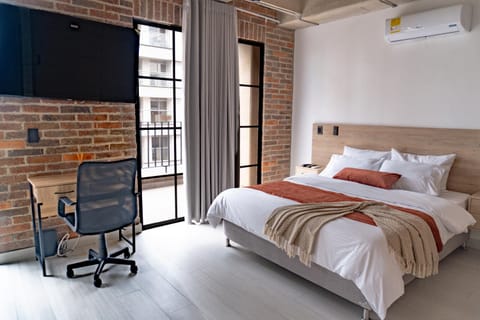 Bed, TV and multimedia, Seating area, Bedroom, air conditioner