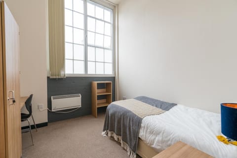 Bed, Seating area, wardrobe