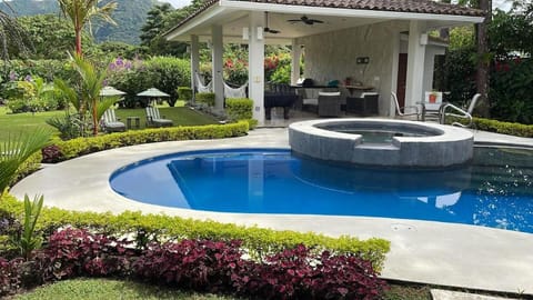 Property building, Patio, Spring, Day, Natural landscape, Garden, Hot Tub, Garden view, Pool view, Swimming pool, sunbed