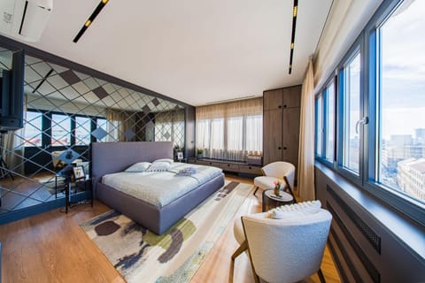 Bed, Seating area, wardrobe