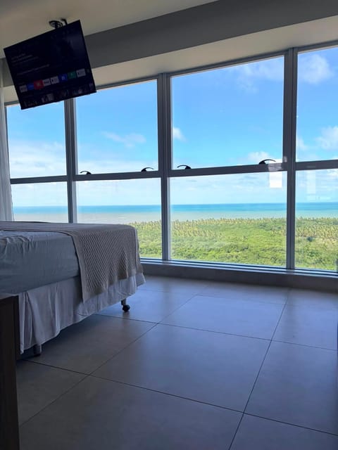 Bed, Natural landscape, TV and multimedia, View (from property/room), Bedroom, Sea view