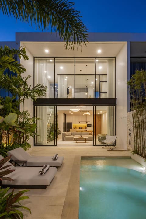 Property building, Night, Living room, Seating area, Pool view