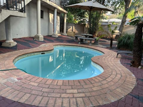 Property building, Patio, Natural landscape, Garden, Garden view, Pool view, Swimming pool