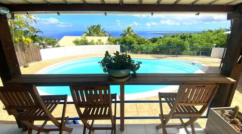 Property building, Patio, Day, Natural landscape, View (from property/room), Balcony/Terrace, Dining area, Pool view, Sea view, Swimming pool