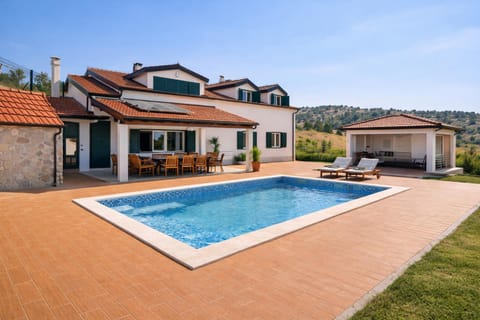 Property building, Day, Natural landscape, Pool view, Swimming pool, sunbed