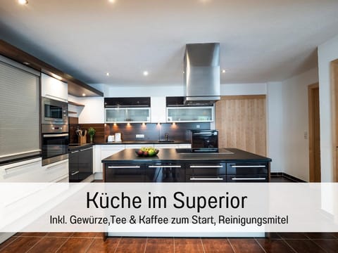 Kitchen or kitchenette, Text overlay, minibar, stove, towels, kitchen