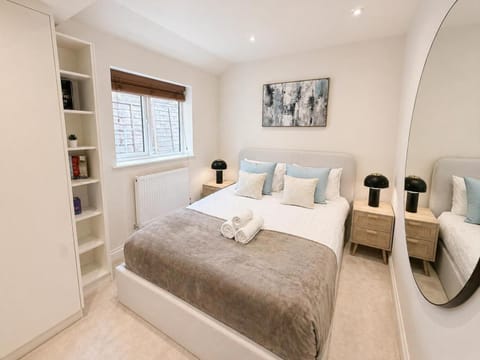 Bed, Decorative detail, Bedroom, flat iron, hair dryier, heating, towels, wardrobe