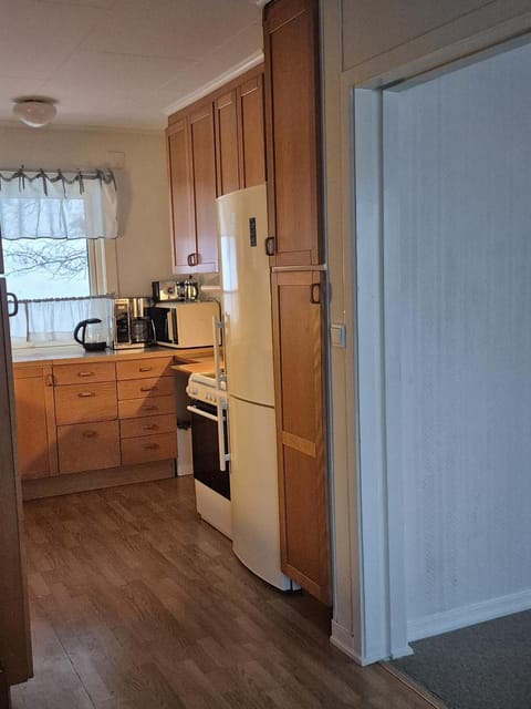 Kitchen or kitchenette, dishwasher, oven, stove
