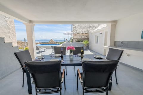 View (from property/room), Seating area, Pool view, Sea view, Swimming pool