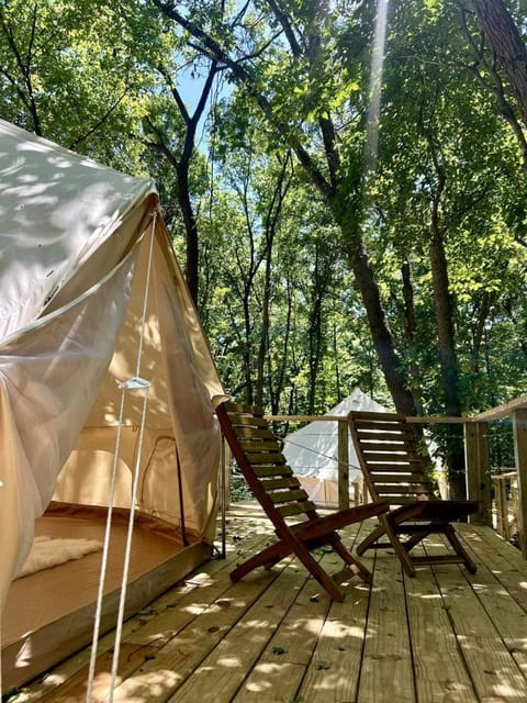 Peaceful Glamping Tents with Elevated Decks, Cozy Fire Pit, and Secluded Forest Views Near Gentry, AR Luxury tent in Arkansas