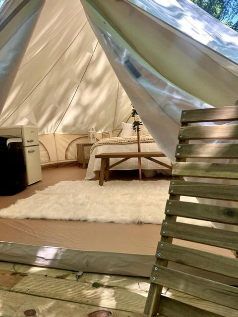 Peaceful Glamping Tents with Elevated Decks, Cozy Fire Pit, and Secluded Forest Views Near Gentry, AR Luxury tent in Arkansas